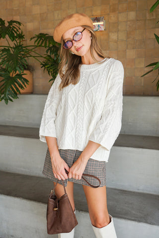 Ivory cable knit sweater with 3/4 length sleeves