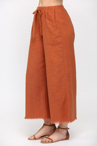 Frayed Hem Cropped Pants in Red Clay